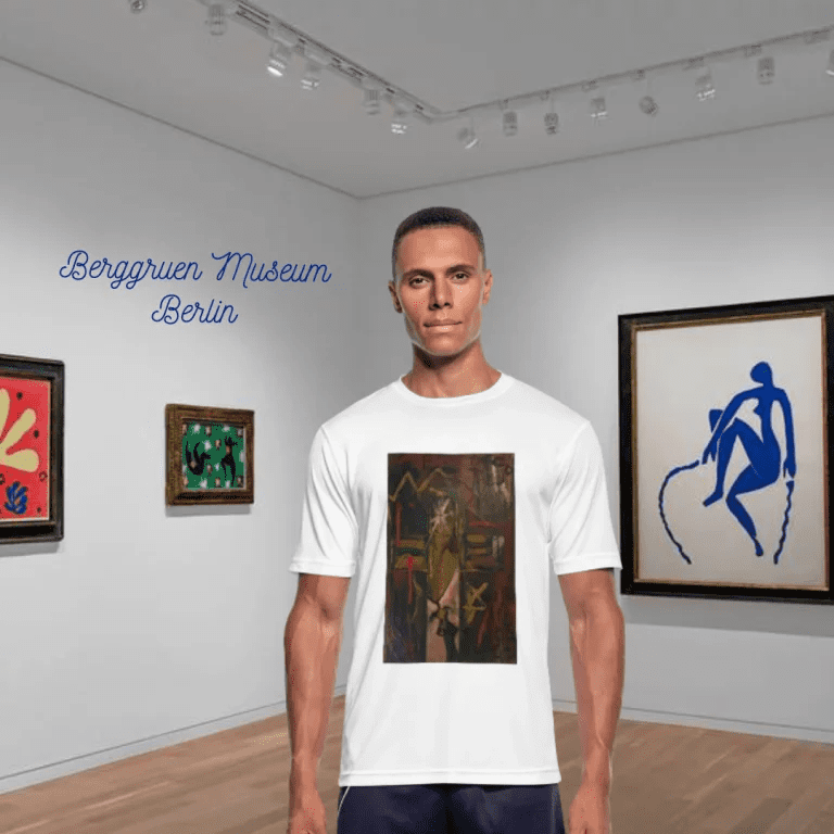 Primer plano de una camiseta blanca de la tienda Policromía que muestra una pintura de estilo expresionista. En la obra se aprecia a una pareja en un abrazo íntimo dándose un beso. La técnica utiliza pinceladas visibles y una paleta de colores donde predominan los tonos carne, azules profundos y toques de rojo, creando una atmósfera de calidez y pasión.